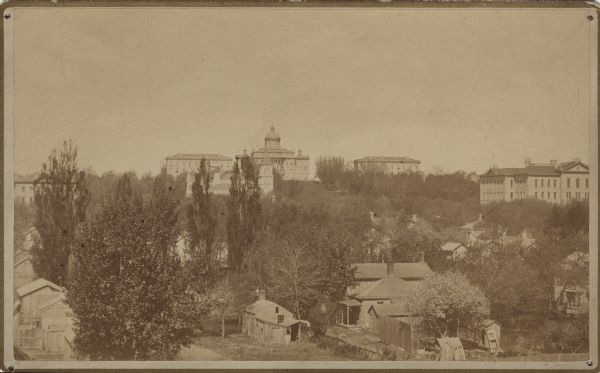 North Hall, the first building on the @UWMadison campus, was erected on this day in 1851. The cost of construction was $19,000.  Here&#39;s North Hall in 1860, to the right of Bascom Hall (South Hall is to the left).   